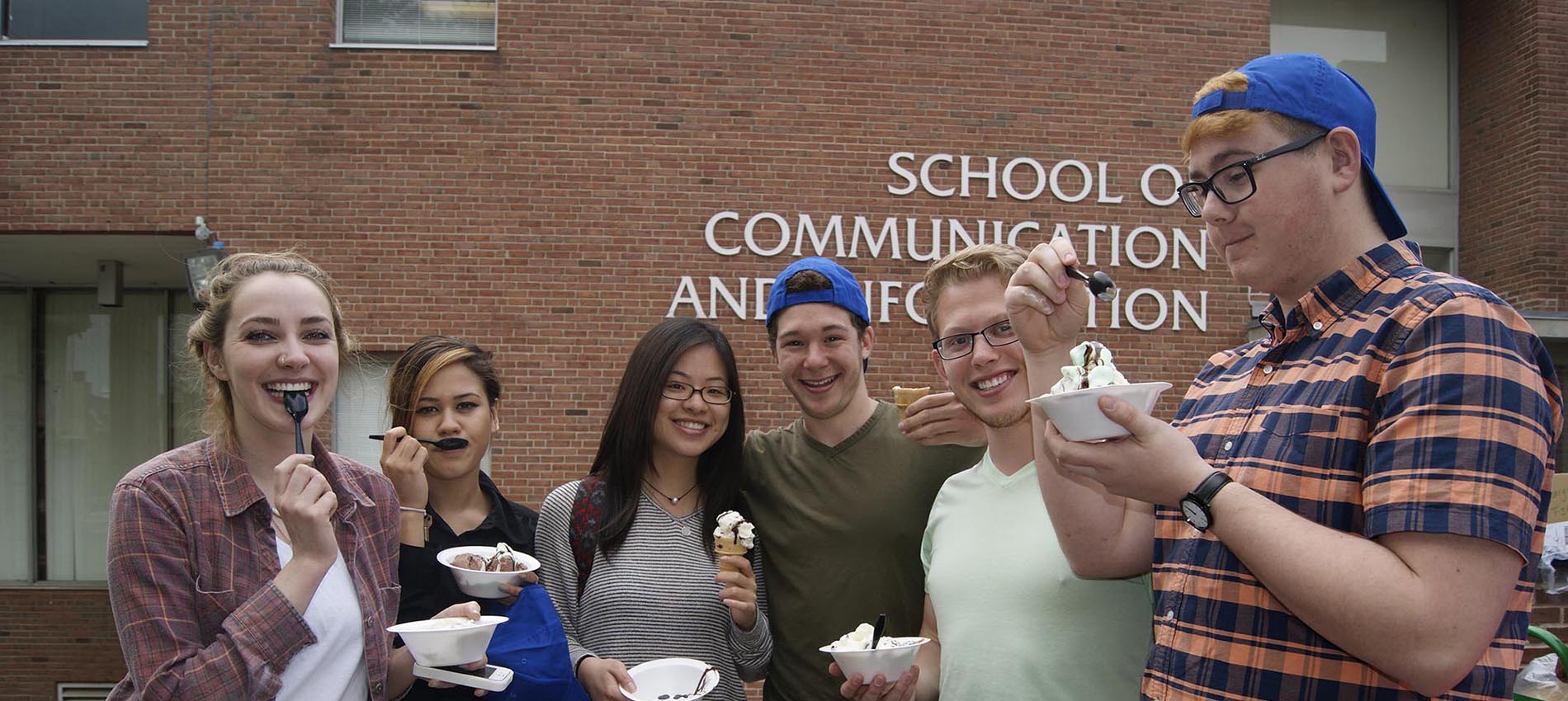 Students eating ice cream at Student Services event