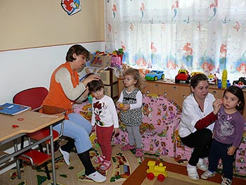 Kindergarten kids lining up for shots